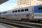 An Amtrak "Cross Country Cafe" AMTK #37000 subs for a Surfliner cafe car.